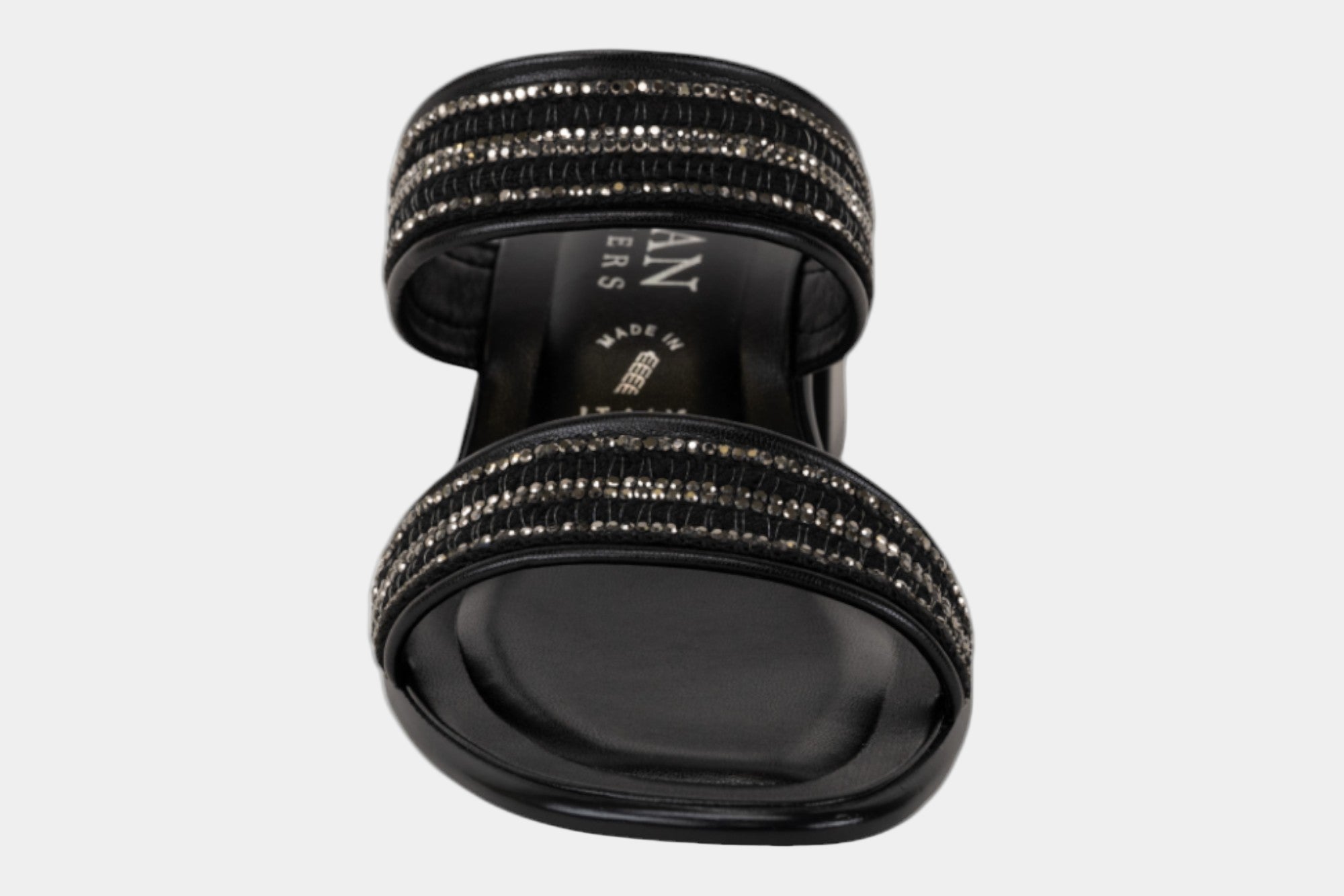 Black sandal with rhinestone embellishments on a white background