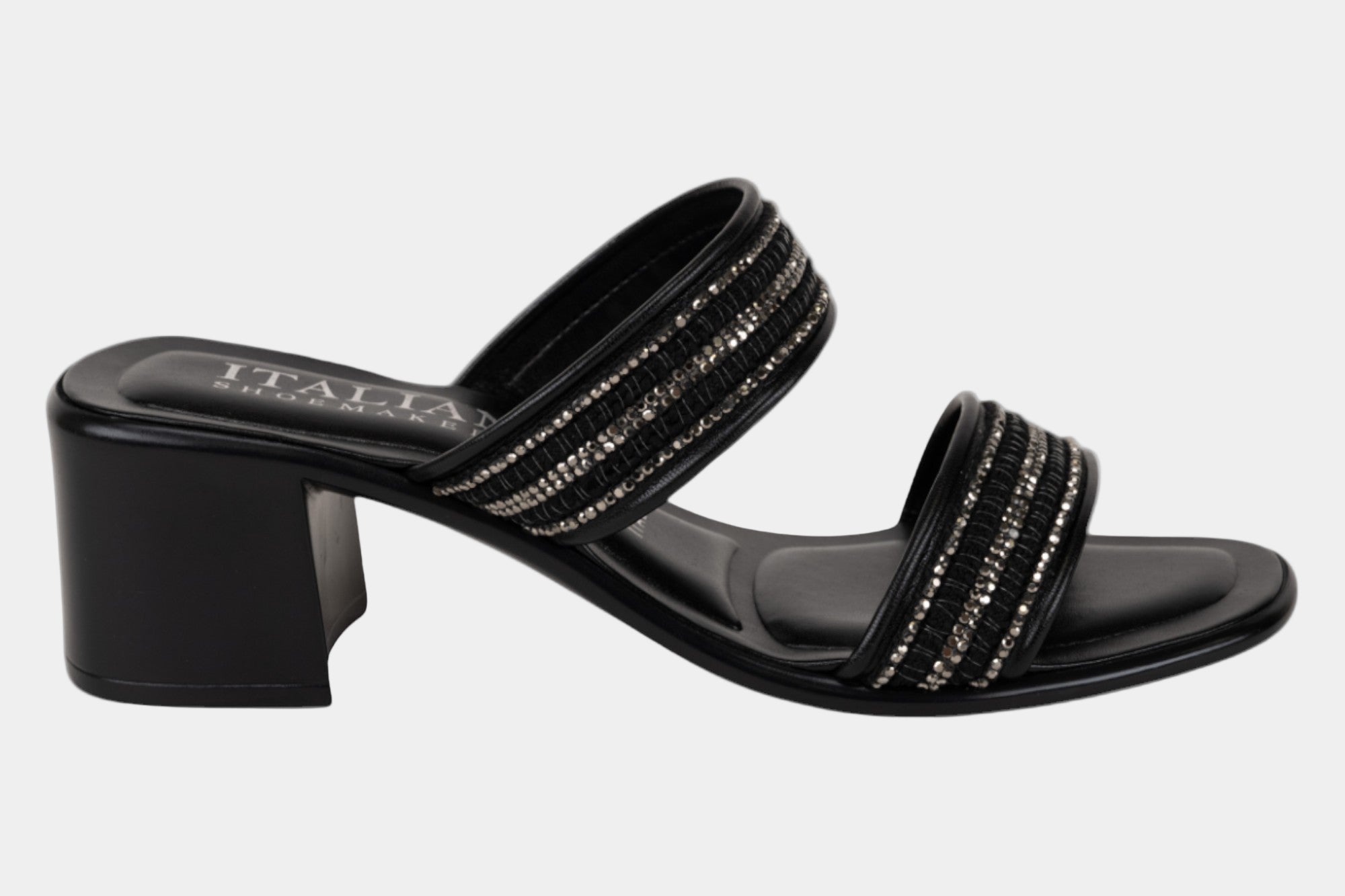 Black sandal with embellishments on a white background