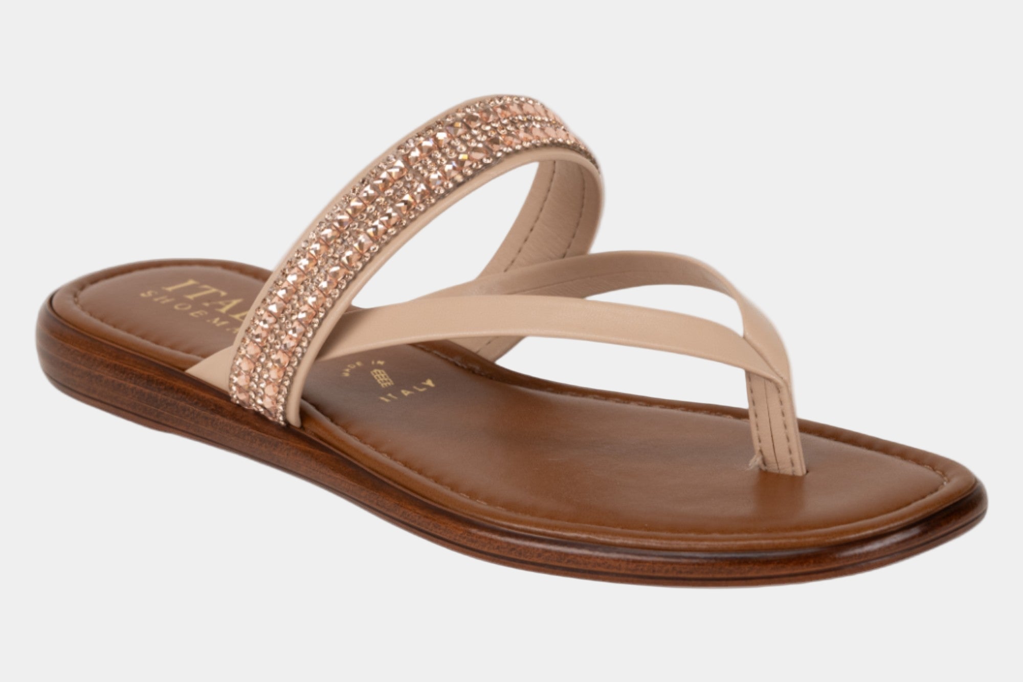 Beige sandal with brown sole on a white background